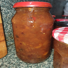 Rhonda's fully cooked mango chutney now taken out of pot and preserved in a jar with lid screwed on tightly